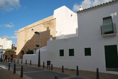 Low angle view of buildings in city against sky