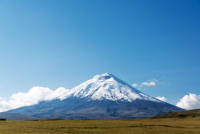 Scenic view of mountains against cloudy sky