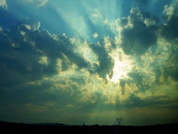 Low angle view of silhouette landscape against sky during sunset