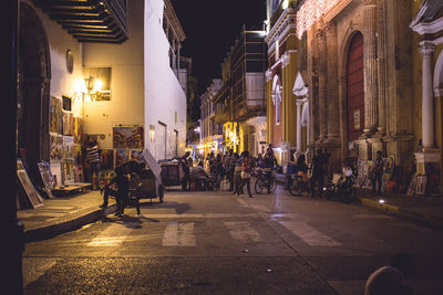 People on street at night