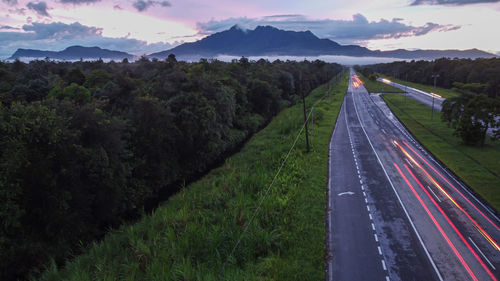 High angle view of road amidst mountains against sky