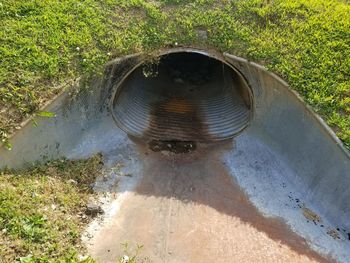 High angle view of water pipe on field