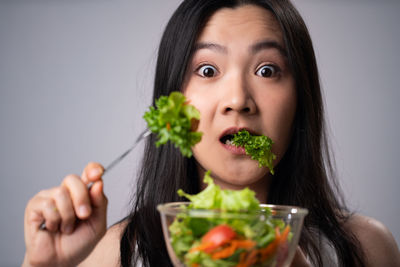 Portrait of woman eating food