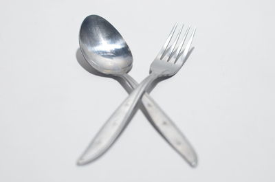 High angle view of wineglass on table against white background
