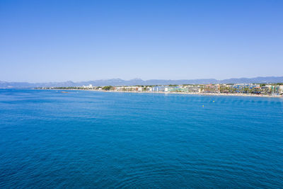 Scenic view of sea against clear blue sky