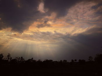 Scenic view of silhouette landscape against sky at sunset