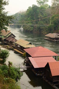 High angle view of river by trees against sky