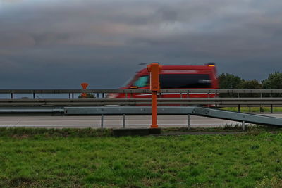 Train on bridge against sky