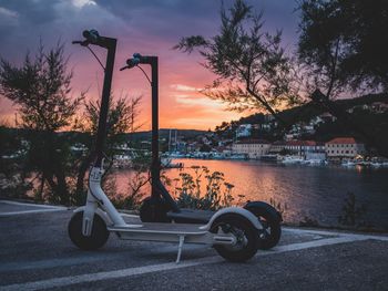 Push scooters on street by river