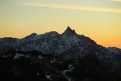 Scenic view of mountains against sky during sunset