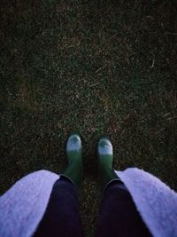 Low section of man standing on ground