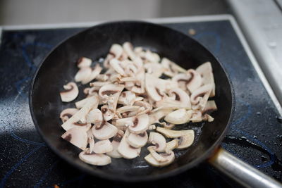 Close-up of chopped meat in frying pan