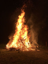 Bonfire on field at night
