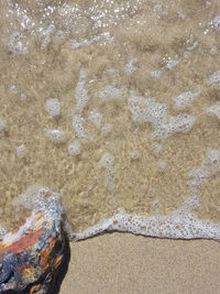 High angle view of surf on beach