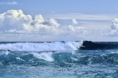 Waves breaking against sea