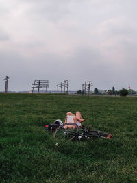 Bicycle on field against sky