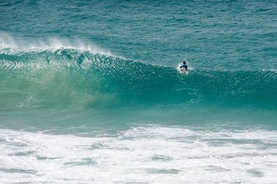 People surfing in sea