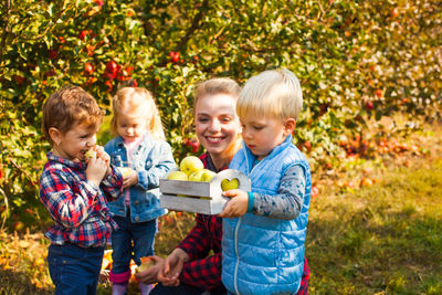 Group of people holding food outdoors