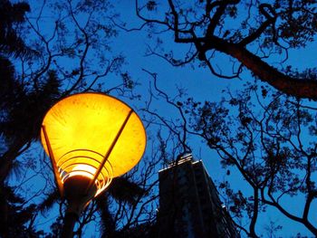 Low angle view of illuminated lantern against clear sky