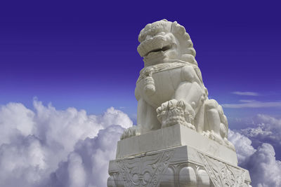 Low angle view of statue against sky