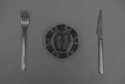 High angle view of fork over white background