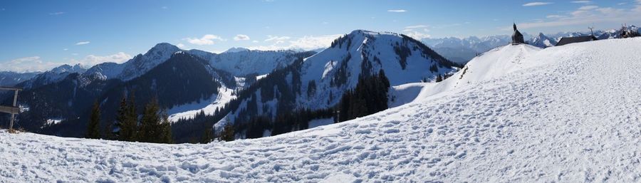 Panoramic view of snowcapped mountains against sky