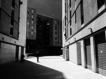 Alley amidst buildings in city