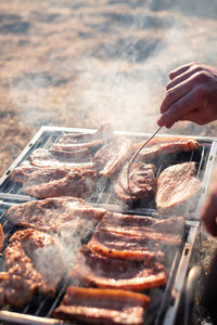 High angle view of meat on barbecue grill