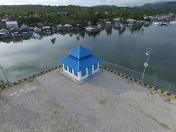 High angle view of buildings by lake