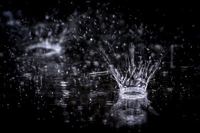 Close-up of water splashing at night