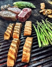 High angle view of meat on barbecue