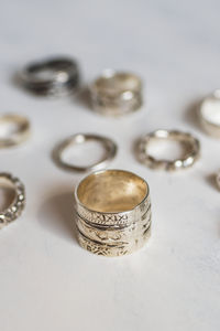 Close-up of wedding rings on table