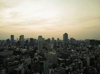 Cityscape against sky during sunset