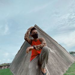 Rear view of man and woman standing against sky