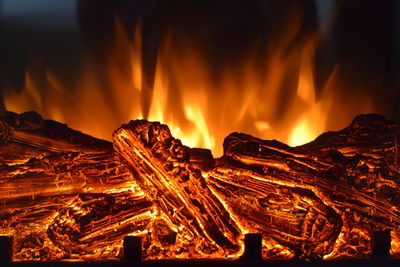 Close-up of fire against sky at night