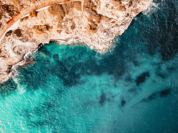 Aerial view of rock formation in sea
