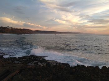 Scenic view of sea against dramatic sky