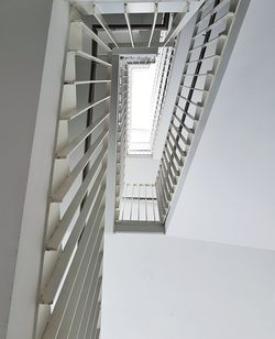 Low angle view of spiral staircase of building against sky