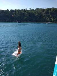 Woman swimming in sea