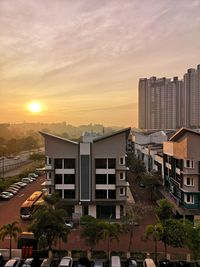 High angle view of buildings against sky during sunset