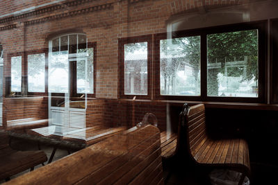 Empty wooden benches in train