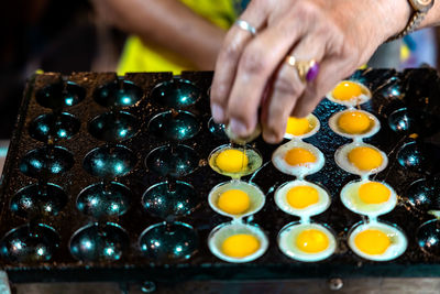 Close-up of person preparing food