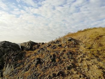 Low angle view of rock against sky