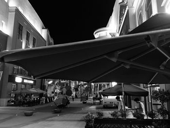 People on street in city at night