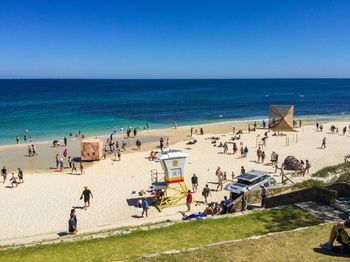 Scenic view of beach against blue sky