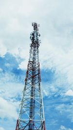 Low angle view of communications tower against sky