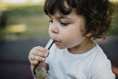 Close-up of girl drinking water