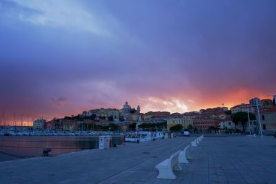 Panoramic view of city against sky at sunset