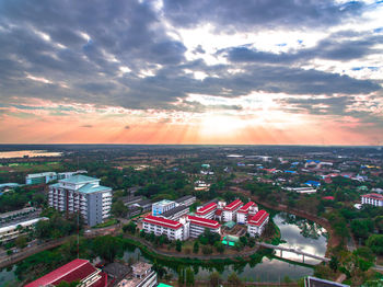 High angle shot of townscape against sky at sunset