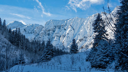 Scenic view of snowcapped mountains against sky